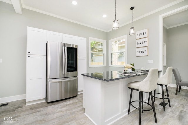 408 W 11th St, Anderson, IN 46016 - kitchen featuring smart refrigerator, white cabinetry, light wood-style floors, recessed lighting, and a breakfast bar area