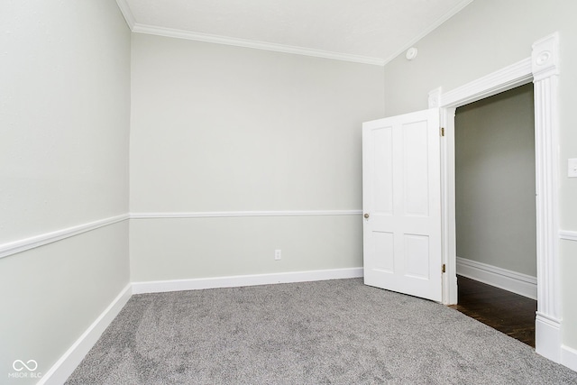 408 W 11th St, Anderson, IN 46016 - unfurnished bedroom with ornamental molding, baseboards, and carpet floors