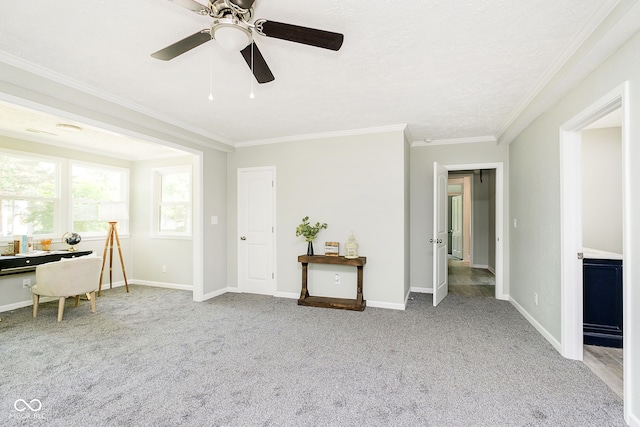 unfurnished office with light colored carpet, ceiling fan, and crown molding