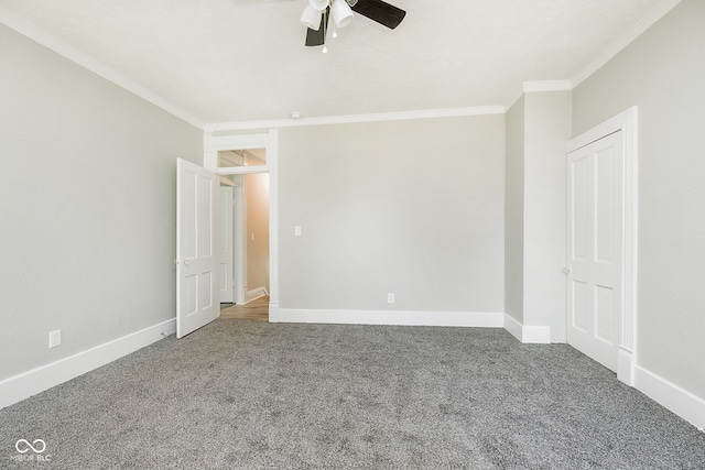 unfurnished bedroom featuring carpet, ceiling fan, and crown molding