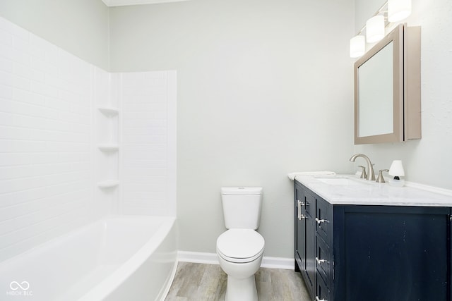 full bathroom featuring shower / bathing tub combination, hardwood / wood-style floors, vanity, and toilet