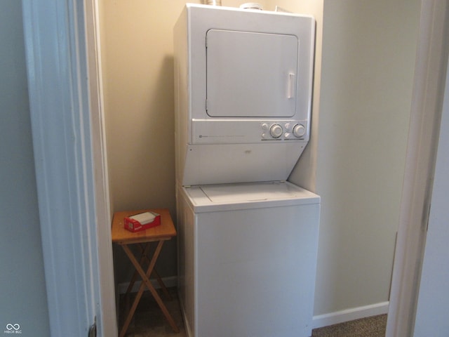 laundry area featuring stacked washer and clothes dryer