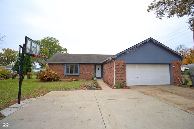 ranch-style home with a garage and a front lawn