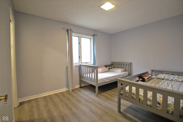 bedroom featuring hardwood / wood-style flooring