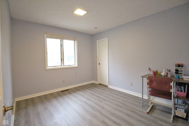 office space with hardwood / wood-style floors