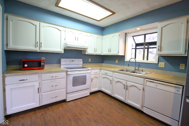 kitchen with dark hardwood / wood-style flooring, white cabinetry, white appliances, and sink