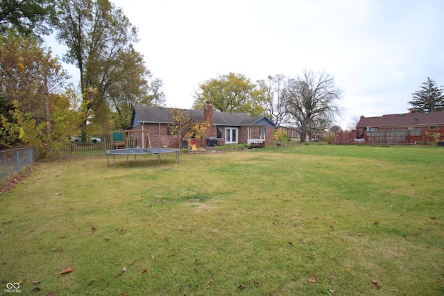 view of yard with a trampoline