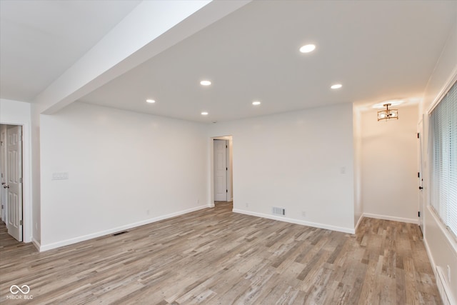 unfurnished room featuring light hardwood / wood-style flooring