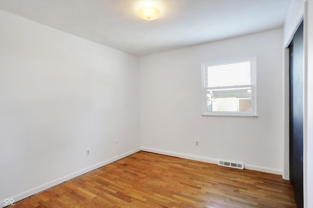 spare room with light wood-type flooring