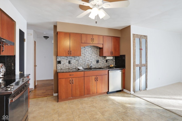 kitchen featuring light tile patterned floors, ceiling fan, stainless steel appliances, decorative backsplash, and sink