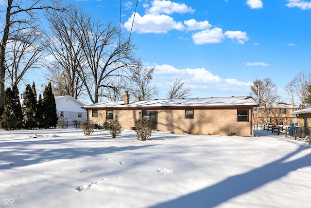 view of snow covered house