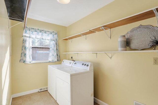 clothes washing area featuring independent washer and dryer