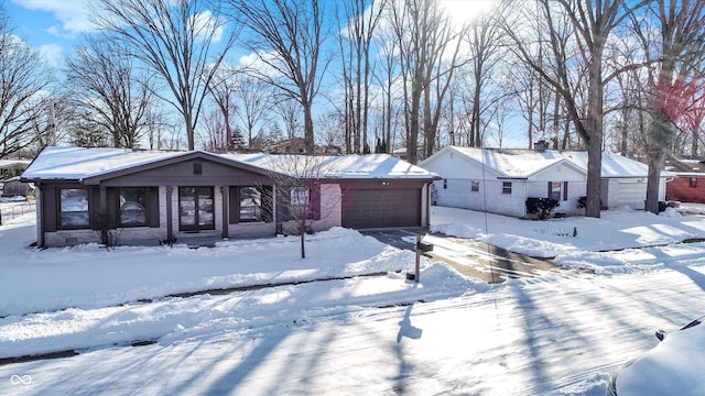 single story home with a garage and a porch