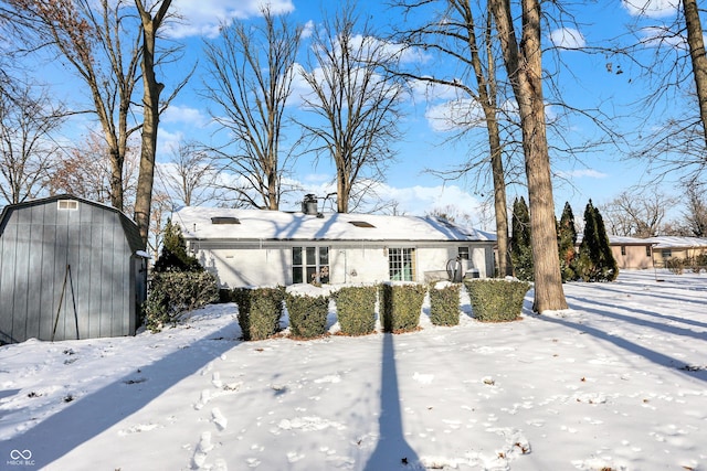 view of front of house featuring a storage shed