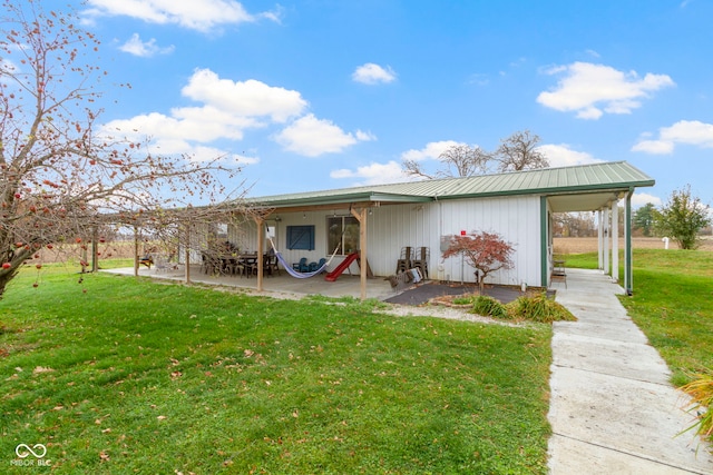 rear view of house with a yard