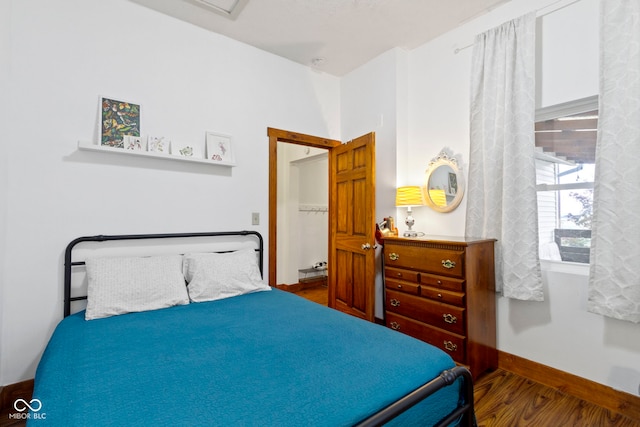 bedroom featuring dark wood-type flooring