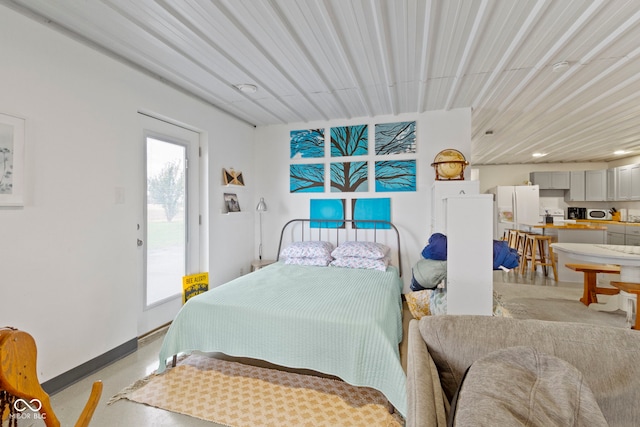 bedroom with white refrigerator