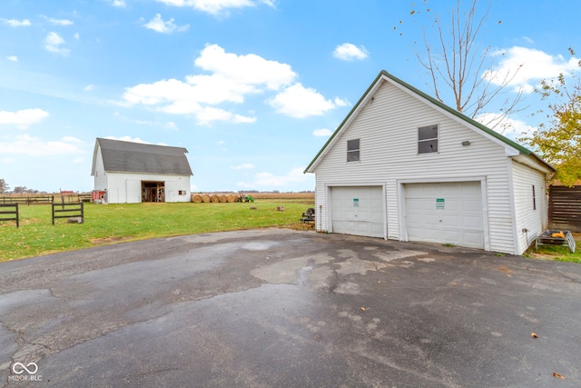 garage with a lawn