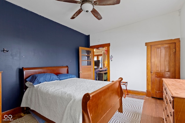 bedroom featuring ceiling fan and light hardwood / wood-style floors