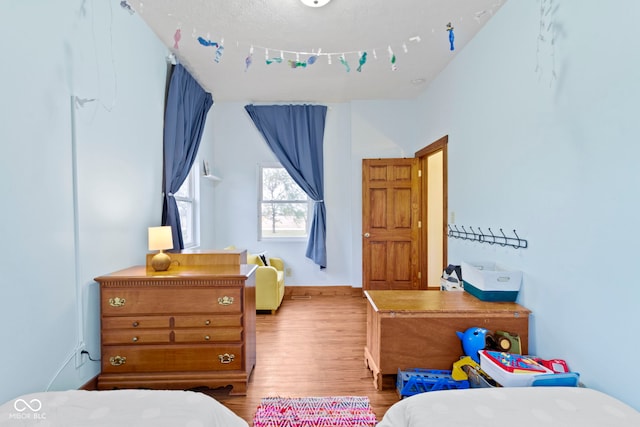 bedroom with light hardwood / wood-style floors