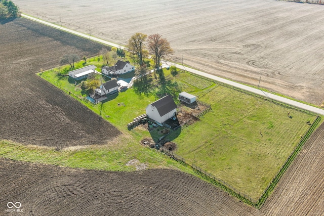 birds eye view of property with a rural view