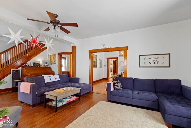 living room featuring hardwood / wood-style flooring and ceiling fan