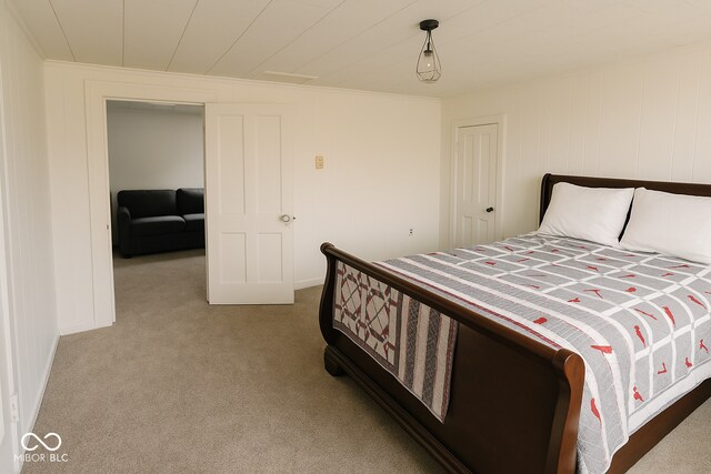 bedroom featuring baseboards and carpet flooring