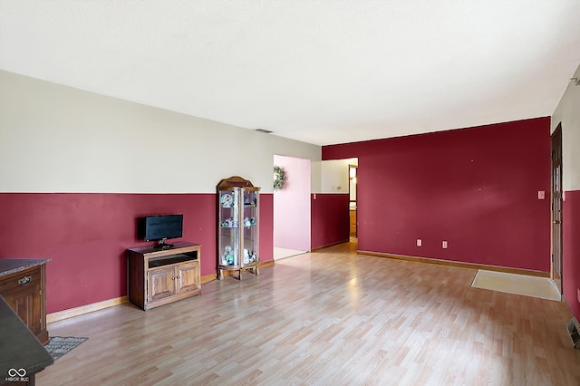 unfurnished living room with light hardwood / wood-style floors