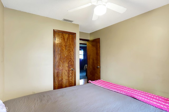 unfurnished bedroom featuring carpet and ceiling fan