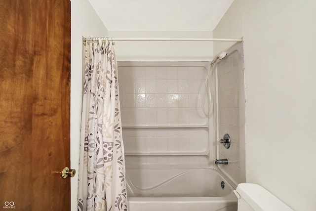 bathroom featuring toilet and shower / bathtub combination with curtain