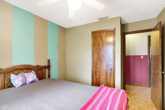 bedroom featuring light parquet flooring and ceiling fan