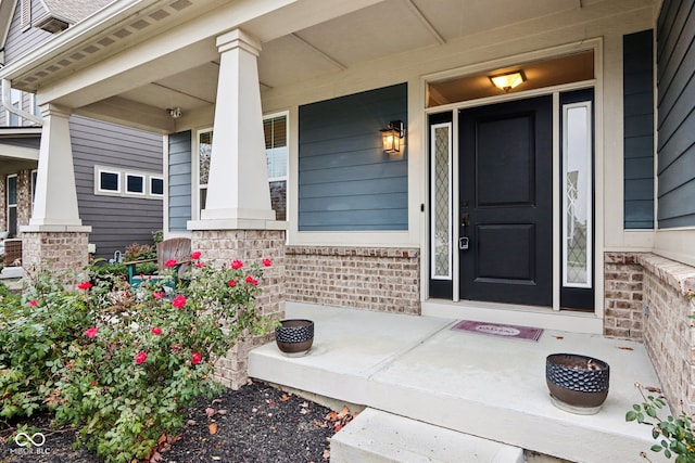 property entrance with covered porch