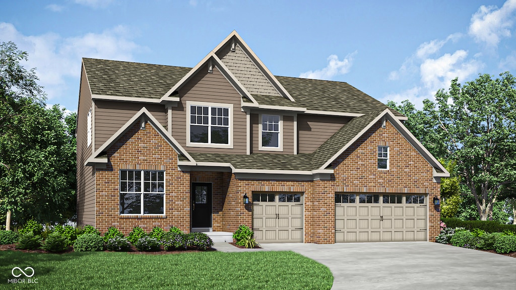 view of front of house featuring a garage and a front lawn