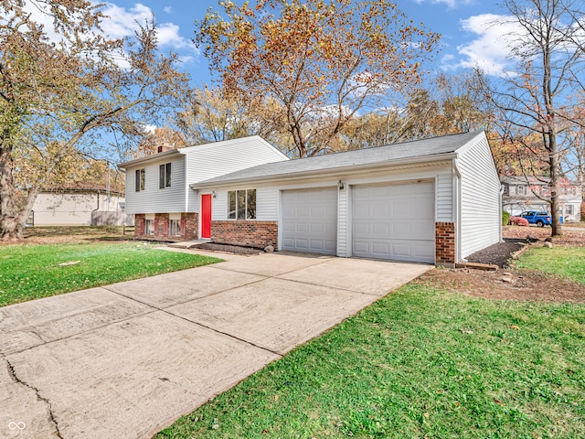 tri-level home with a front lawn and a garage