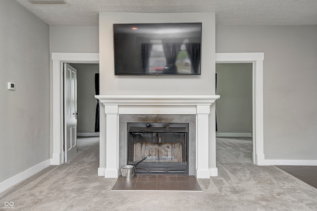 details featuring carpet flooring and a textured ceiling