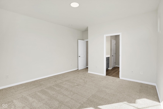 unfurnished bedroom featuring dark carpet