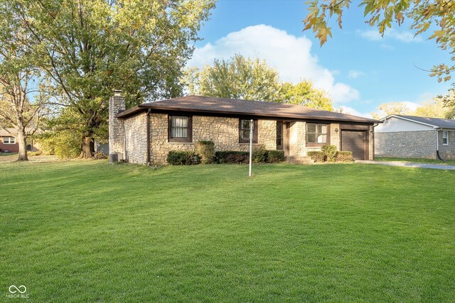 single story home with a front yard and central AC