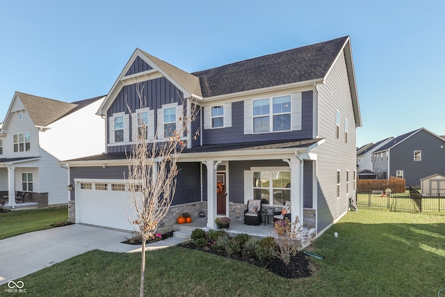 view of front of house featuring a garage and a front yard