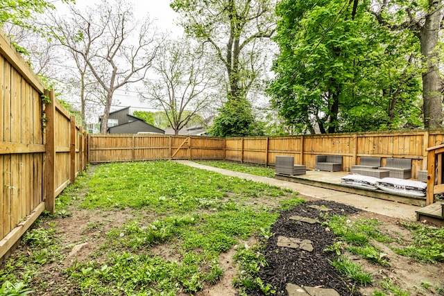 view of yard featuring a fenced backyard and central AC unit