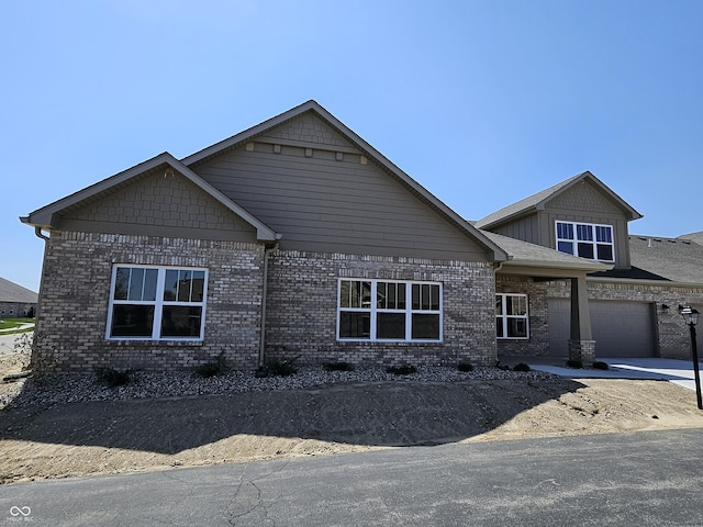 craftsman inspired home with brick siding
