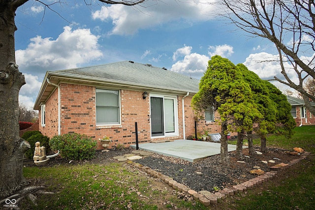 rear view of property featuring a patio