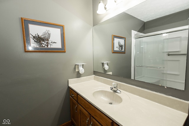 bathroom with vanity and walk in shower