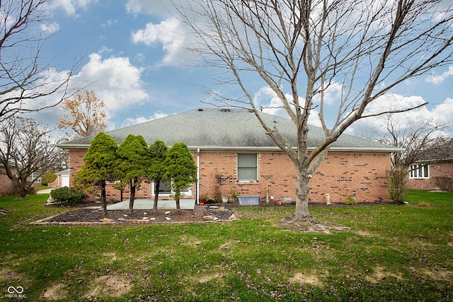 rear view of property with a patio area and a yard