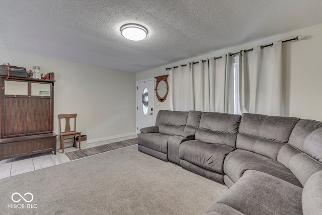 carpeted living room featuring a textured ceiling