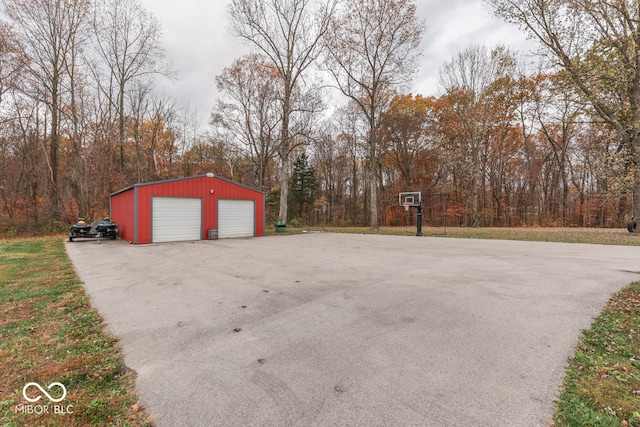 view of patio featuring a garage and an outdoor structure