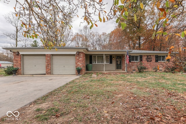 8190 Beech Grove Rd, Martinsville, IN 46151 - ranch-style house with brick siding, an attached garage, covered porch, and driveway