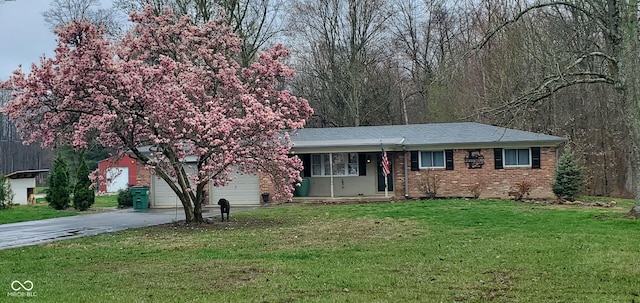 8190 Beech Grove Rd, Martinsville, IN 46151 - view of front of property featuring brick siding, driveway, an attached garage, and a front lawn