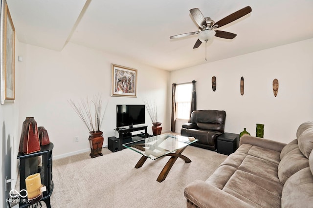 carpeted living room featuring ceiling fan