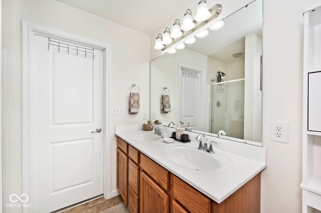 bathroom with walk in shower and vanity