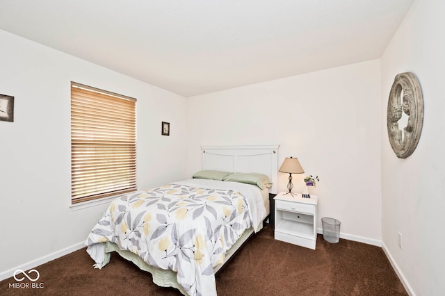 bedroom with dark carpet